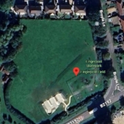 A satellite view of Fingerpost Field, showing a large green park area with a skatepark at the lower edge, surrounded by roads and houses. The location pin marks "Fingerpost Skatepark" and nearby streets are labeled.