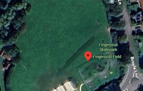 A satellite view of Fingerpost Field, showing a large green park area with a skatepark at the lower edge, surrounded by roads and houses. The location pin marks "Fingerpost Skatepark" and nearby streets are labeled.