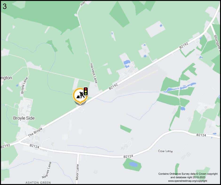 A map highlighting a pedestrian crossing near Broyle Side on the B2192. The crossing is marked with a walking symbol and traffic light icon. Nearby roads include the B2124, Cow Lane, and Moor Lane, with green areas and fields visible.